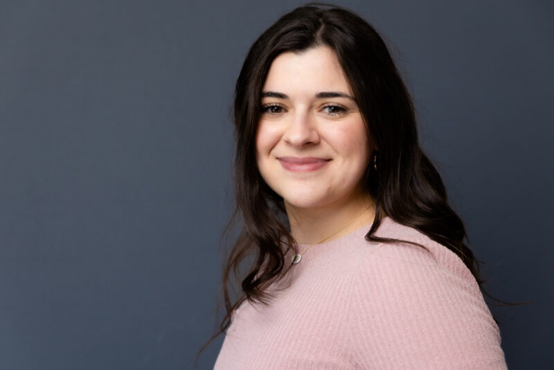 Gorgeous in studio professional headshot with a simple gray background