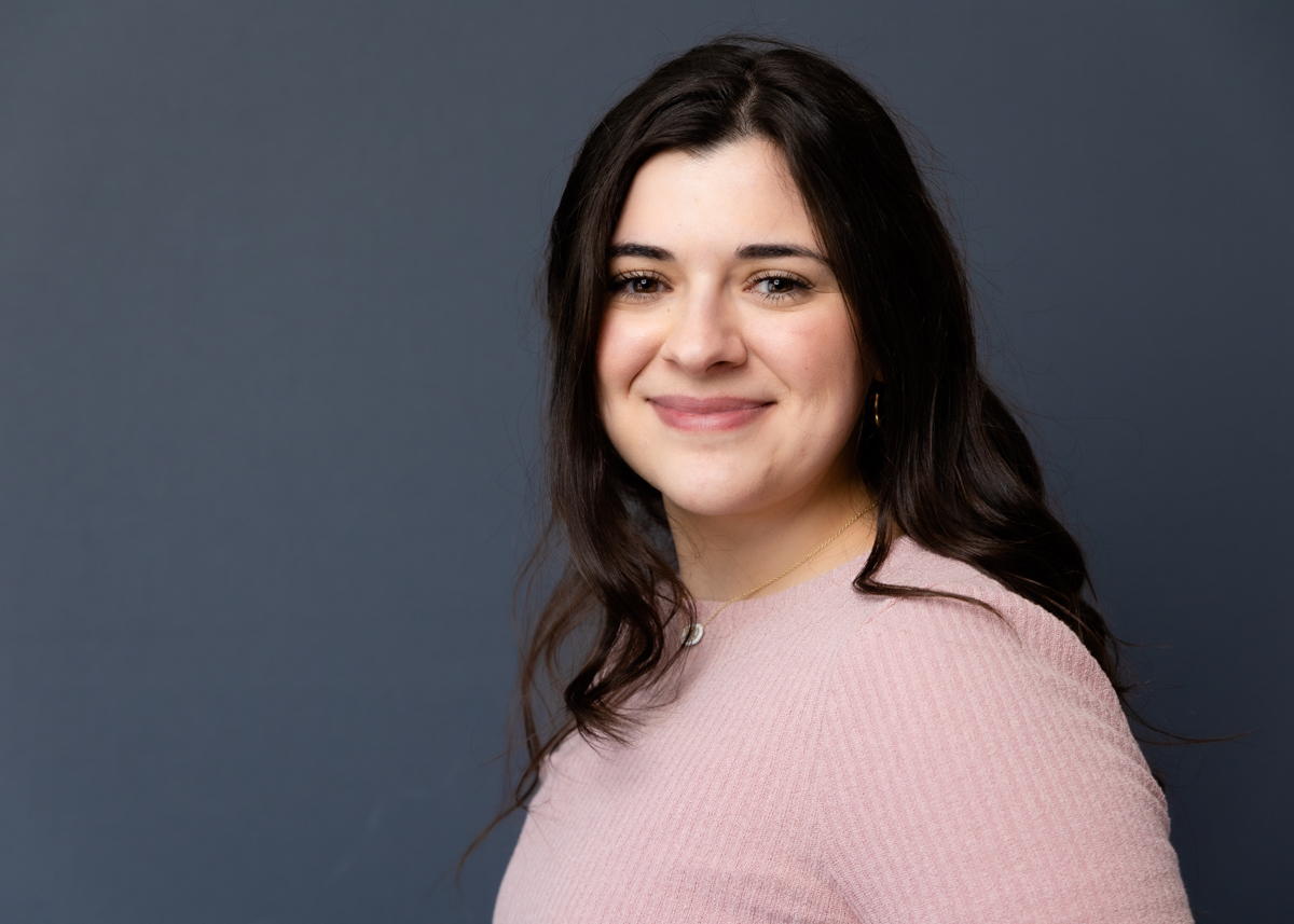 Gorgeous in studio professional headshot with a simple gray background