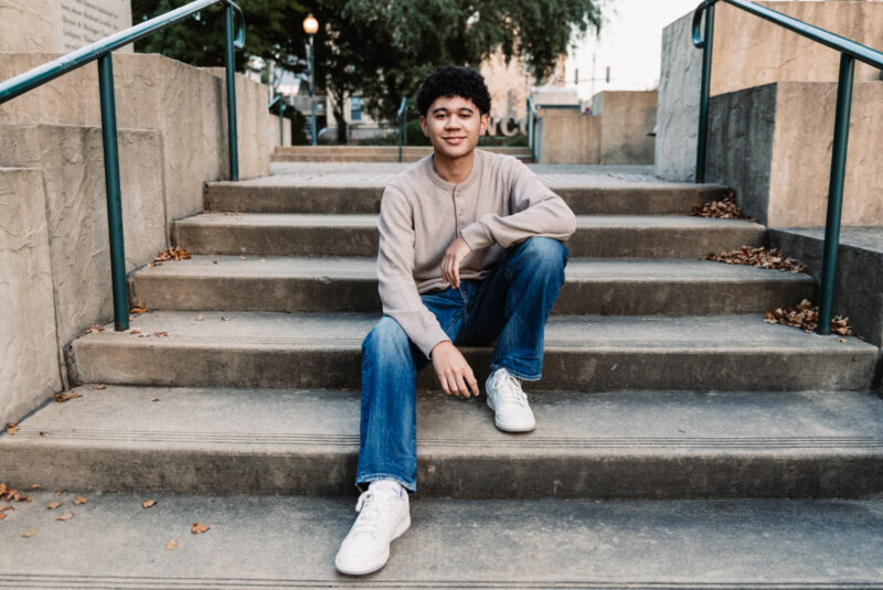 Lincoln Way West High School New Lenox Senior sitting on steps in Lockport IL